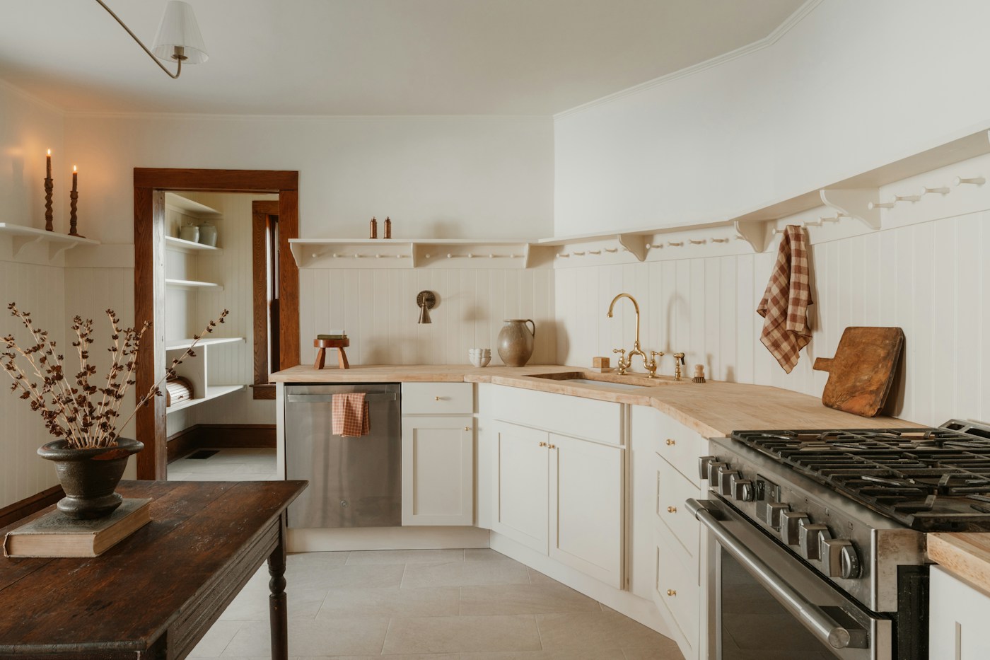 Minimal kitchen with timber floor and white cabinets